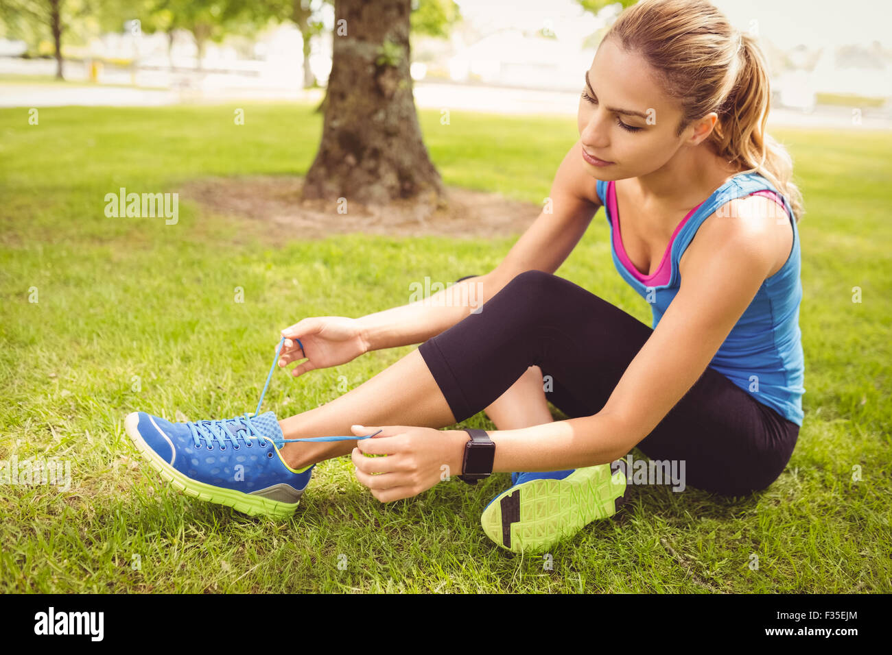 View of Woman tying shoelace hi-res stock photography and images - Alamy