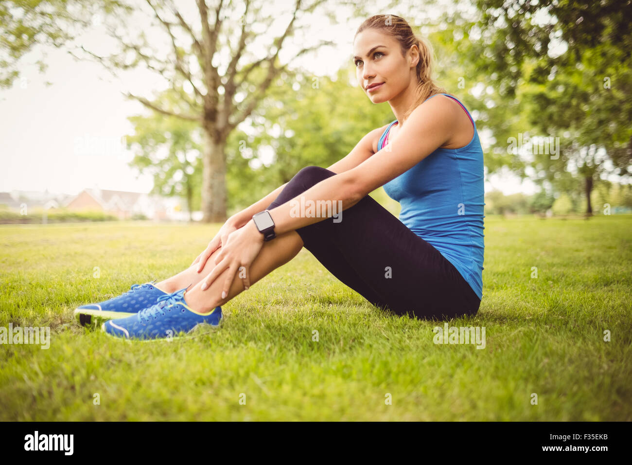 Full length of woman exercising with crossed legs Stock Photo