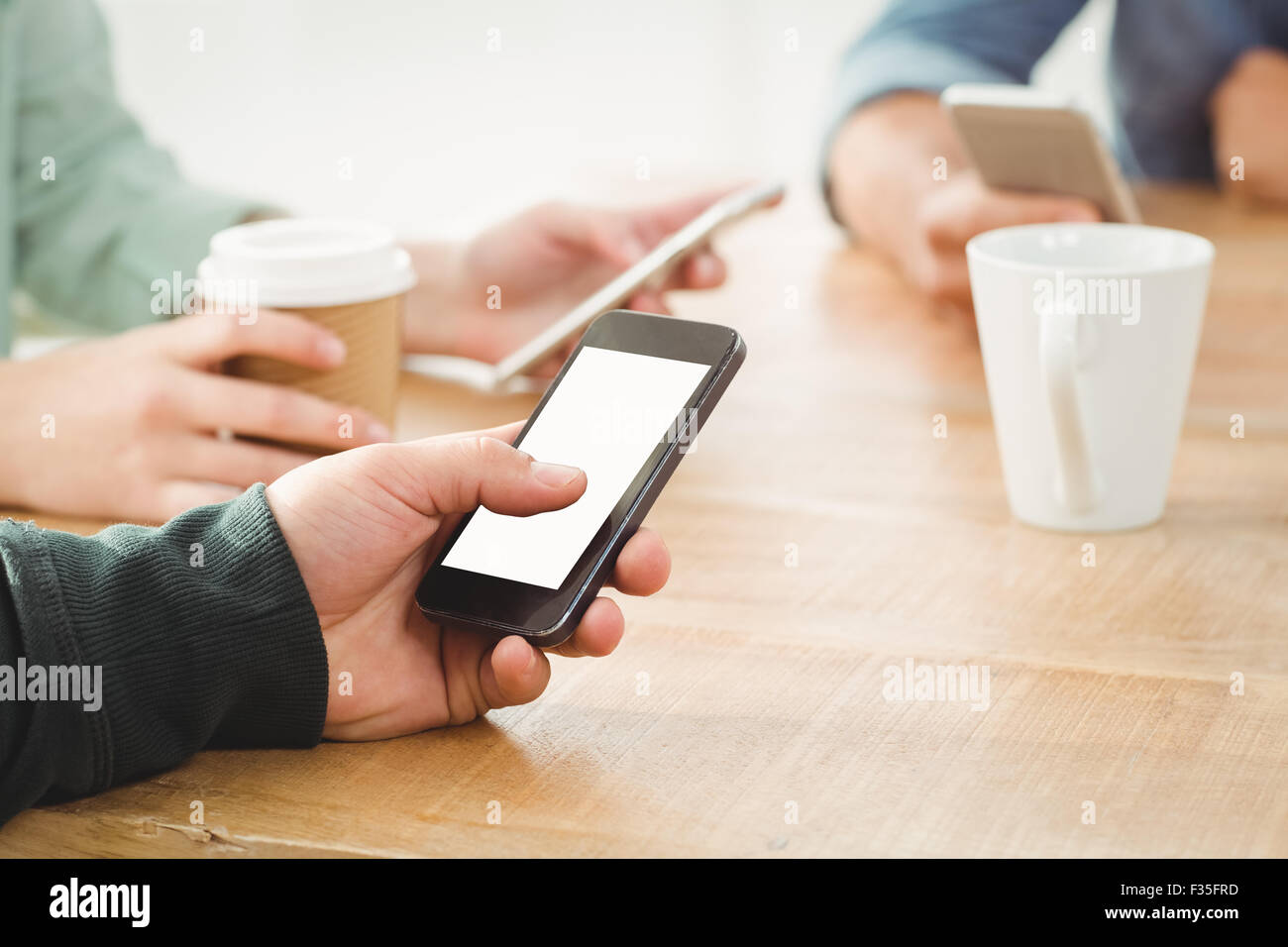 Cropped hands using smartphone Stock Photo