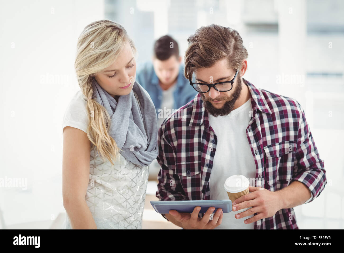 Business man woman tablet hi-res stock photography and images - Alamy