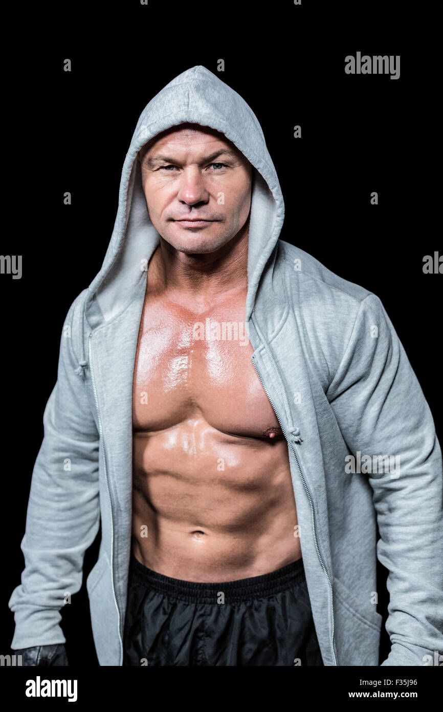 Portrait of confident macho man in hood Stock Photo