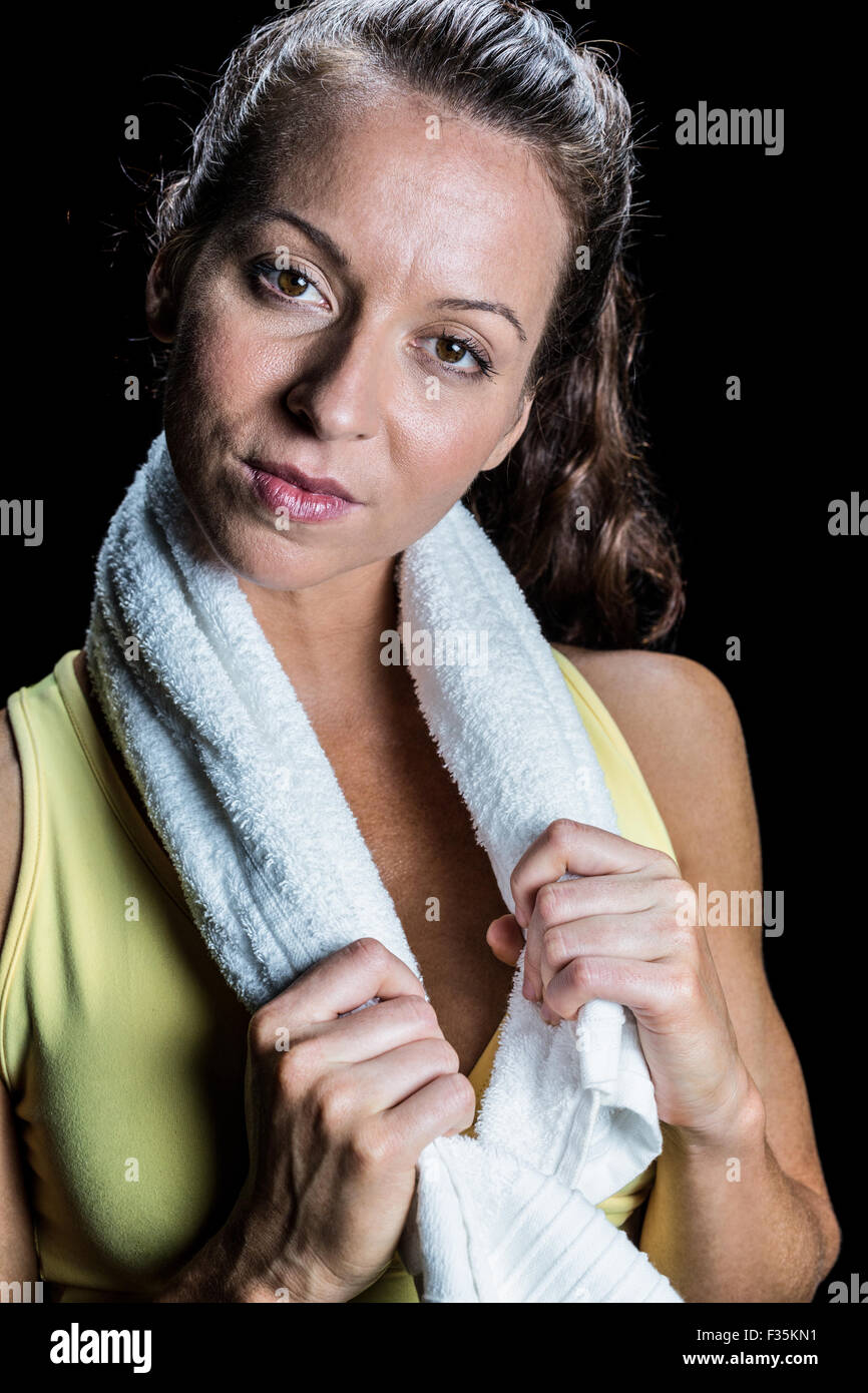 Portrait of pretty athlete with towel around neck Stock Photo - Alamy