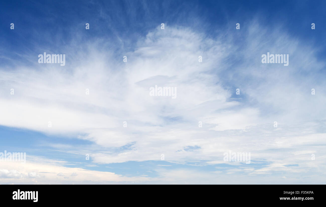 Bright blue sky with white clouds, natural background photo Stock Photo