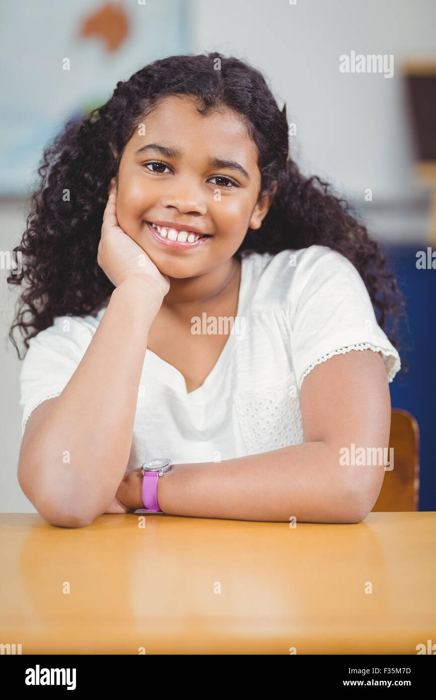 Smiling pupil sitting in a classroom Stock Photo - Alamy
