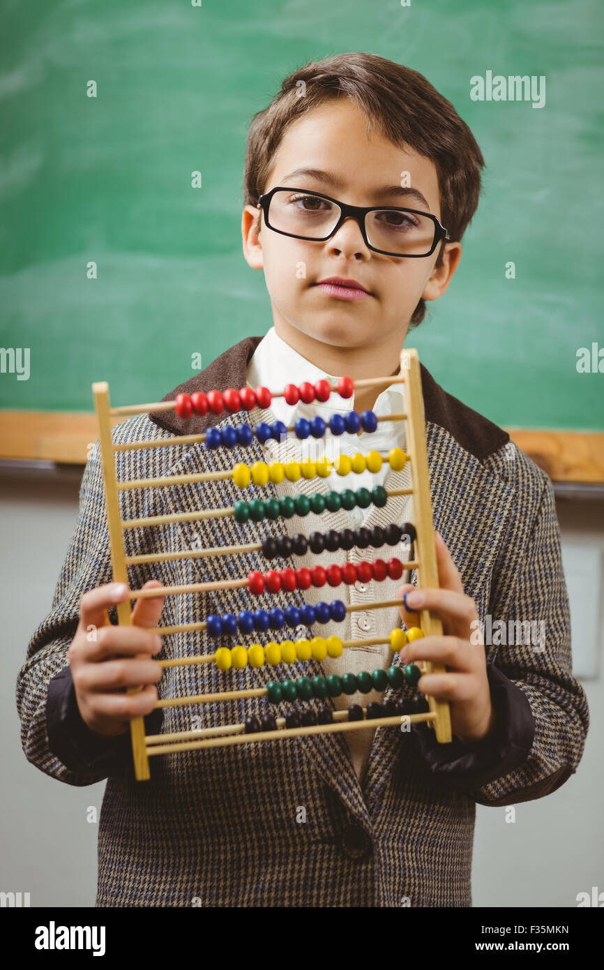 Pupil dressed up as teacher holding abacus Stock Photo - Alamy