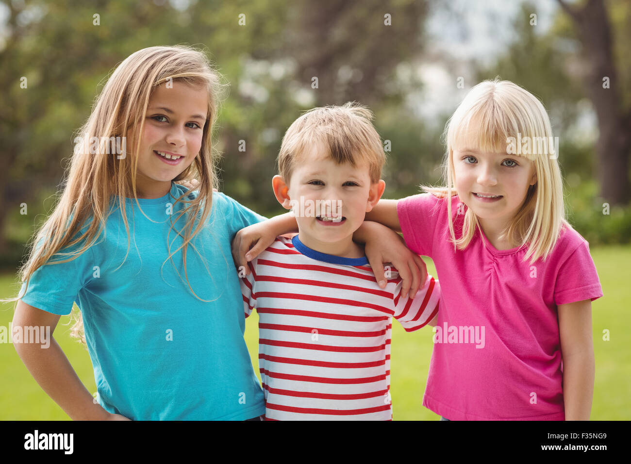 Boy girl arms around other hi-res stock photography and images - Alamy