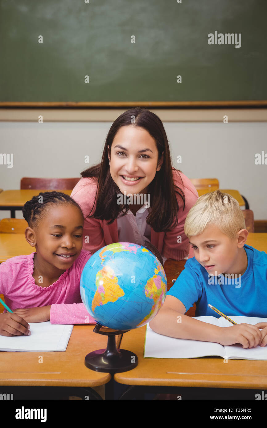 Teacher sitting with her students Stock Photo - Alamy