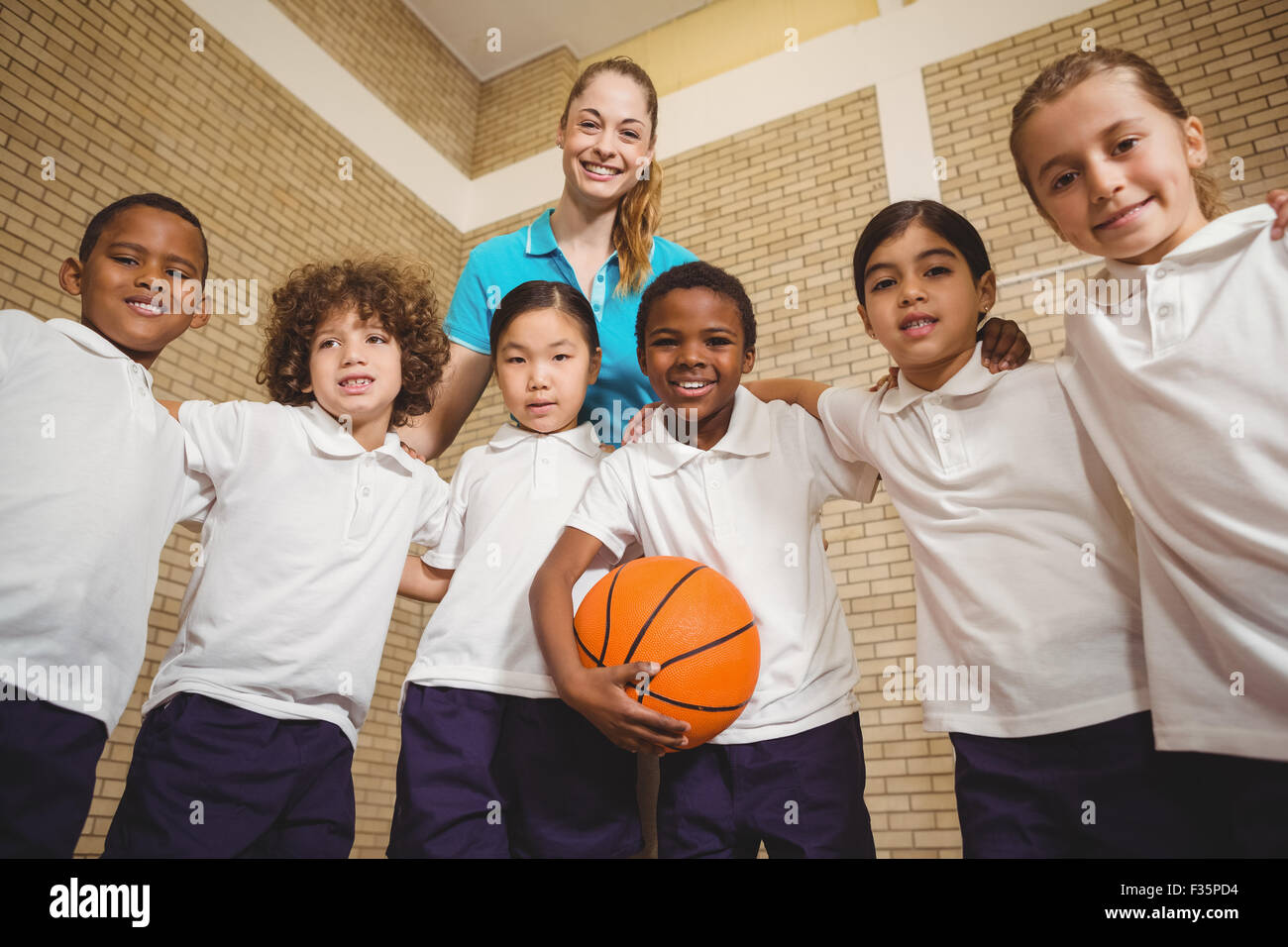 Students and teacher looking at the camera Stock Photo - Alamy