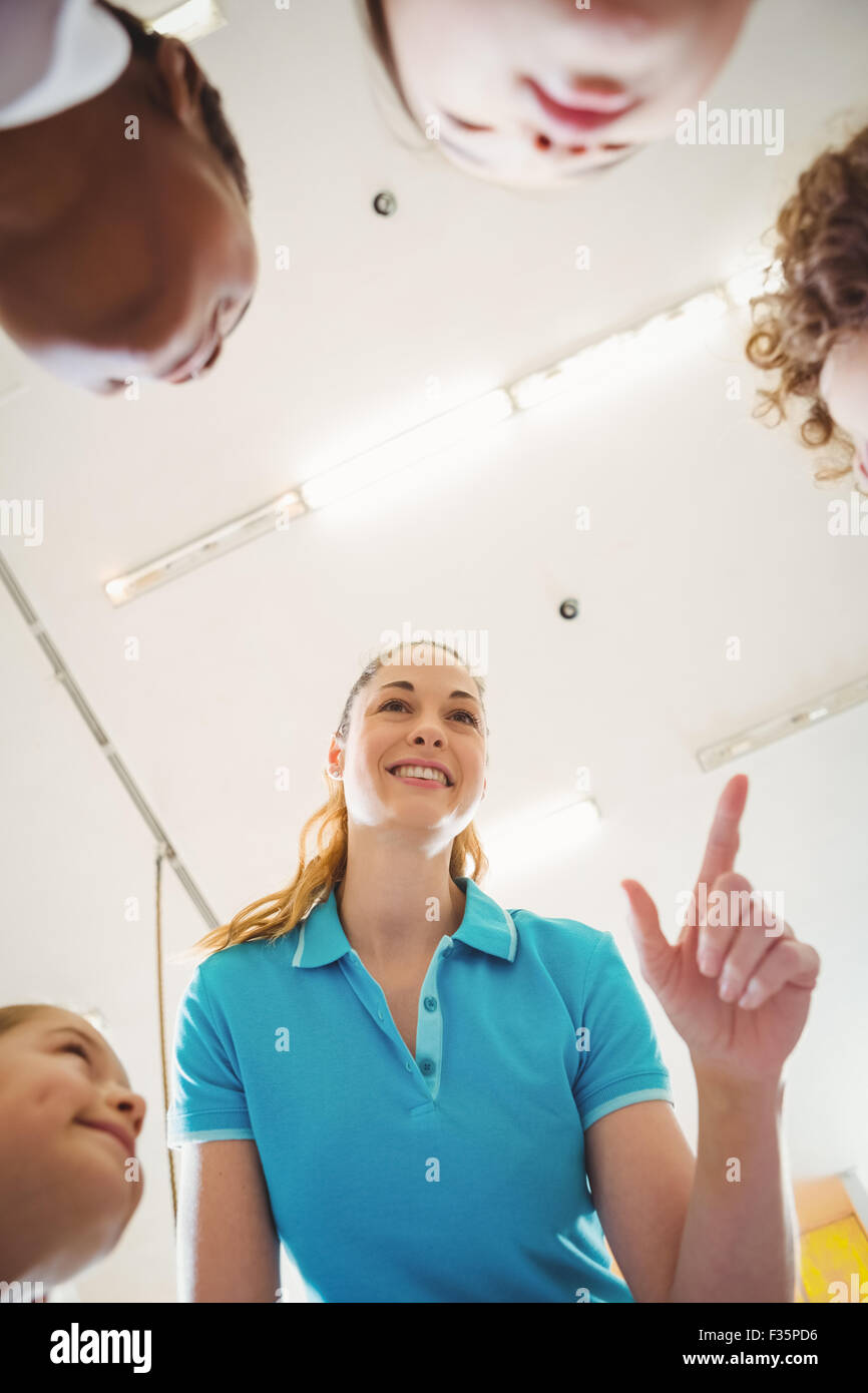 Teacher talking with some students Stock Photo - Alamy