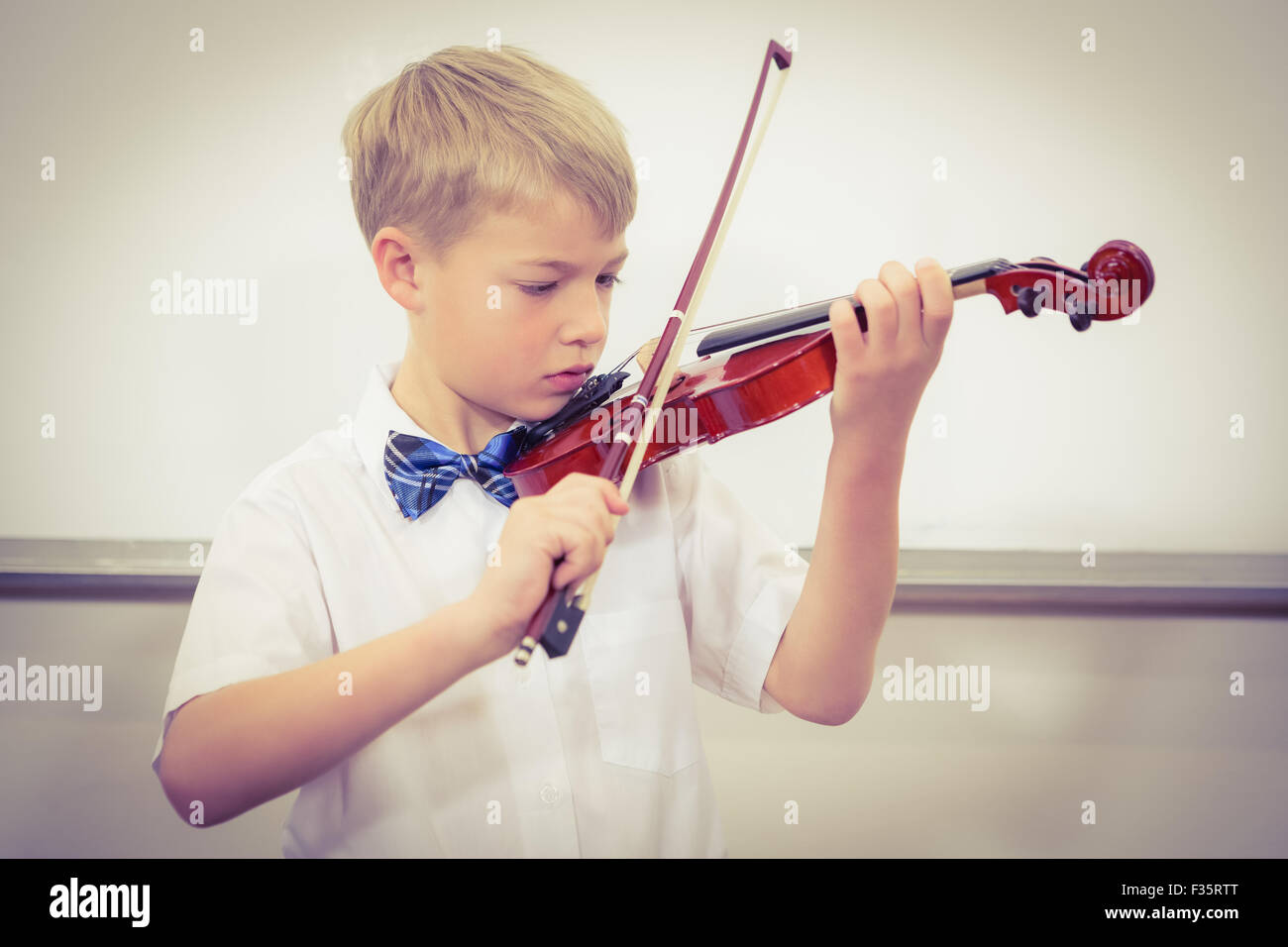 Concentrating Student playing a violin Stock Photo - Alamy