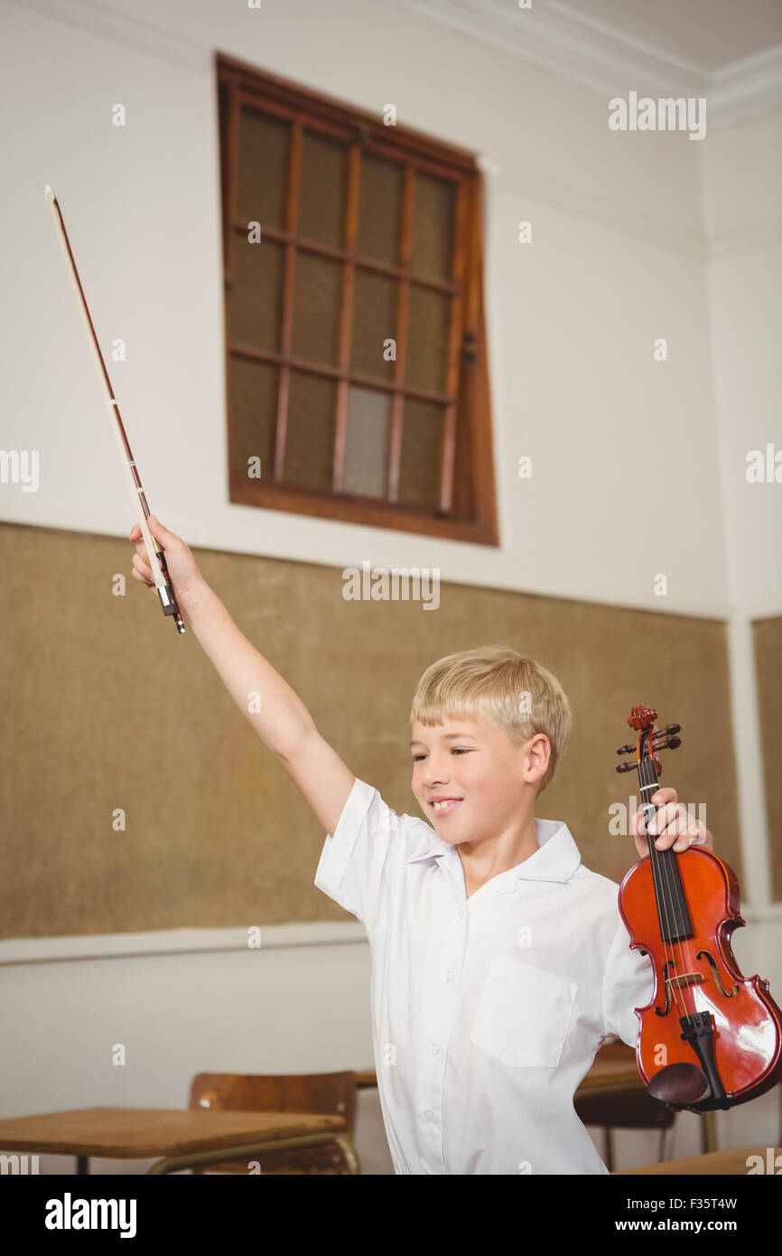 Student using a violin in class Stock Photo - Alamy