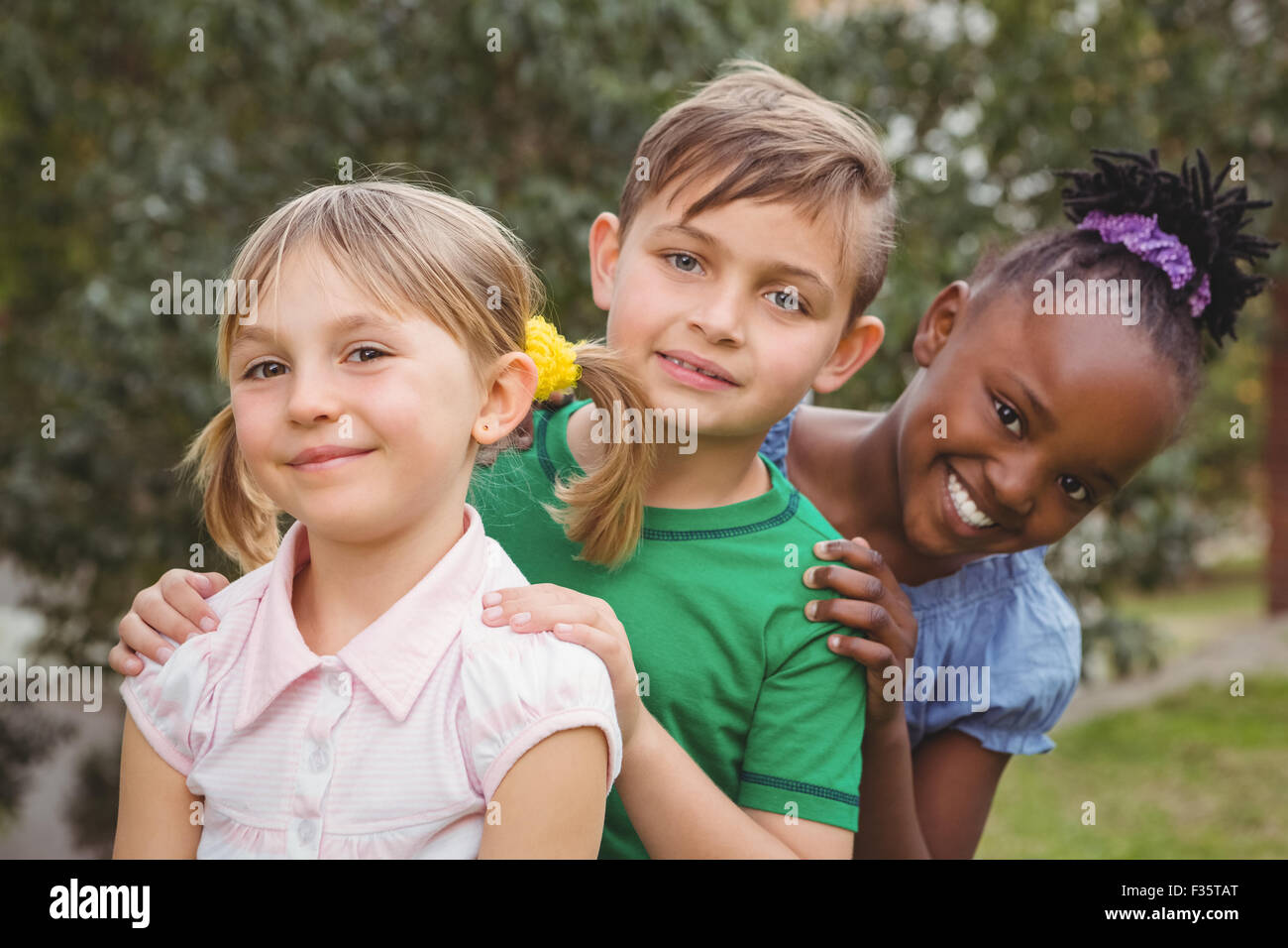 Smiling students looking at the camera Stock Photo - Alamy