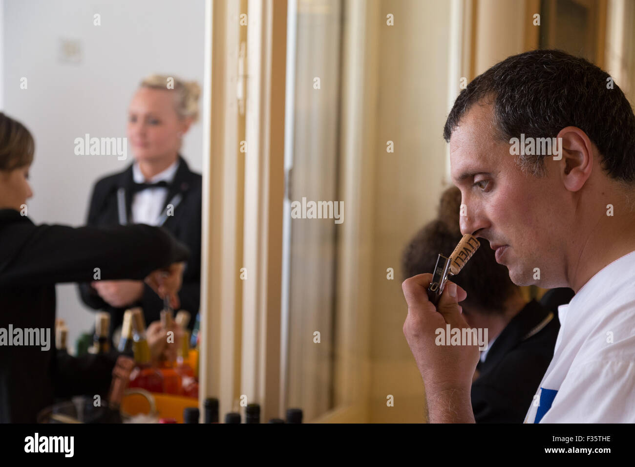 snuffing wine cork to taste quality Stock Photo