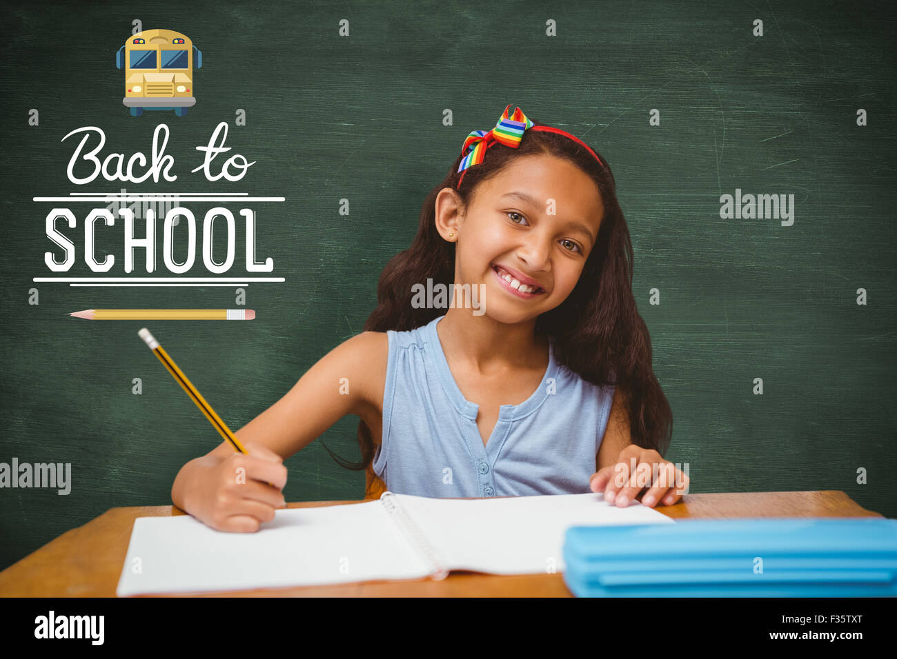 Composite image of pupil at her desk Stock Photo - Alamy