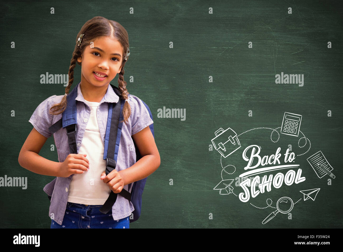 Composite image of cute pupil smiling at camera Stock Photo - Alamy