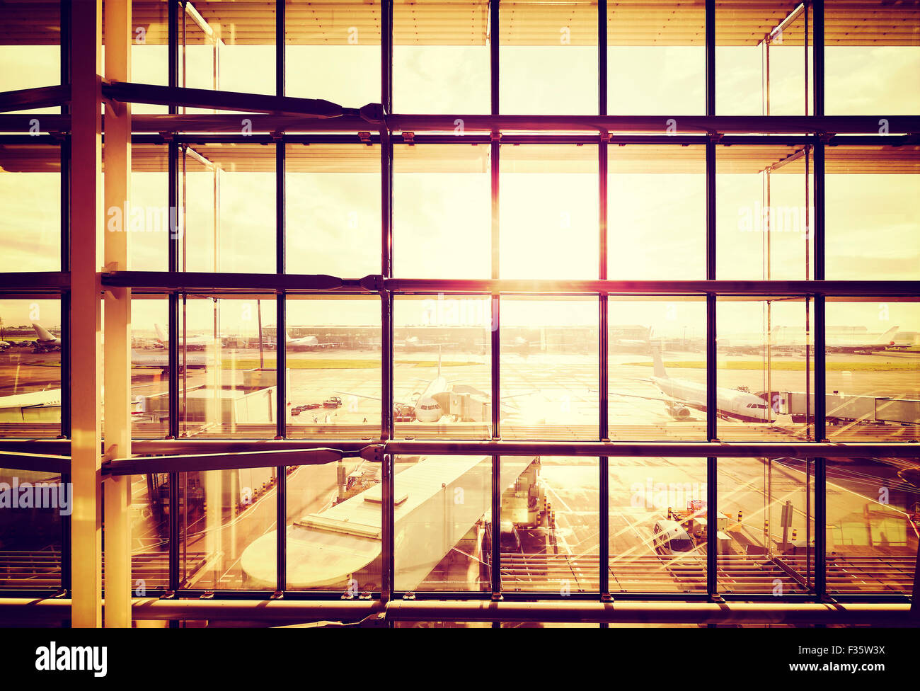 Vintage filtered picture of an airport, transportation and business travel concept. Stock Photo