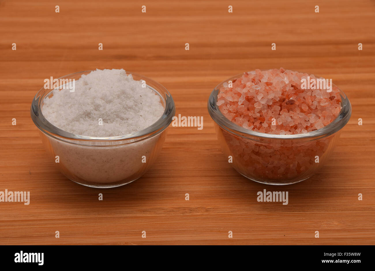 Choose your salt Himalayan or rock salt (side view) on wooden bamboo