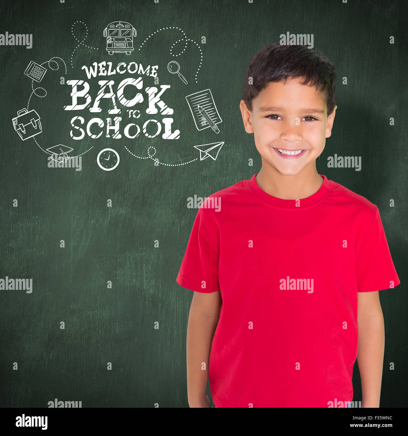 Composite image of cute boy smiling at camera Stock Photo - Alamy