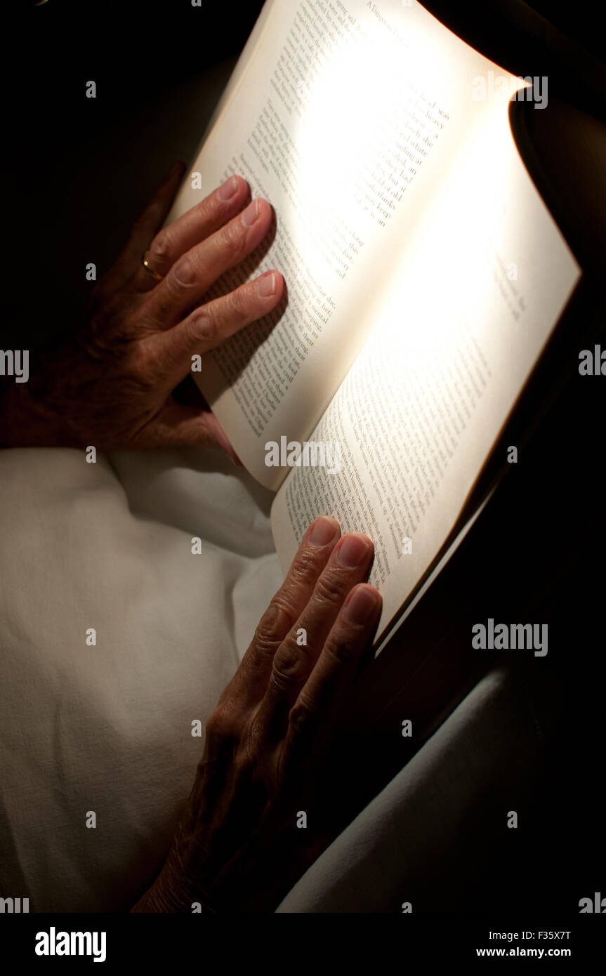 hands on a book Stock Photo