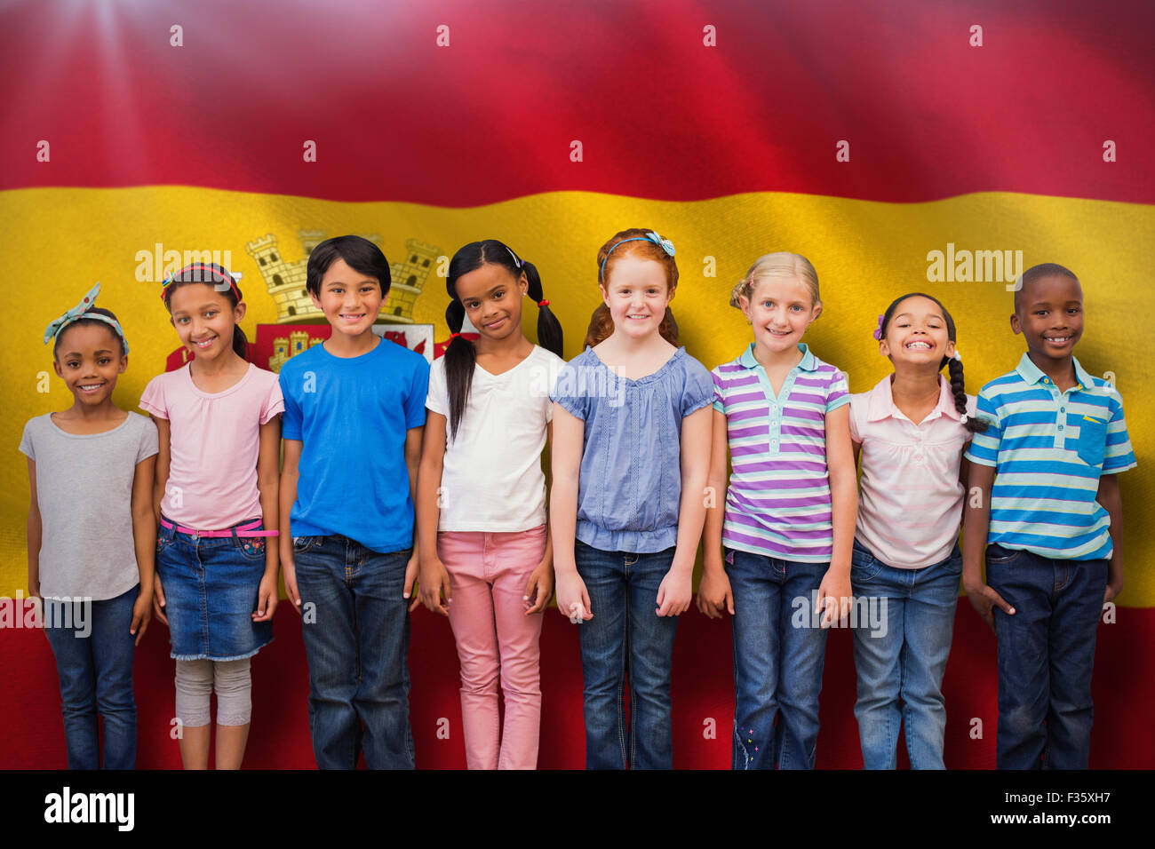 Composite image of cute pupils smiling at camera in classroom Stock ...