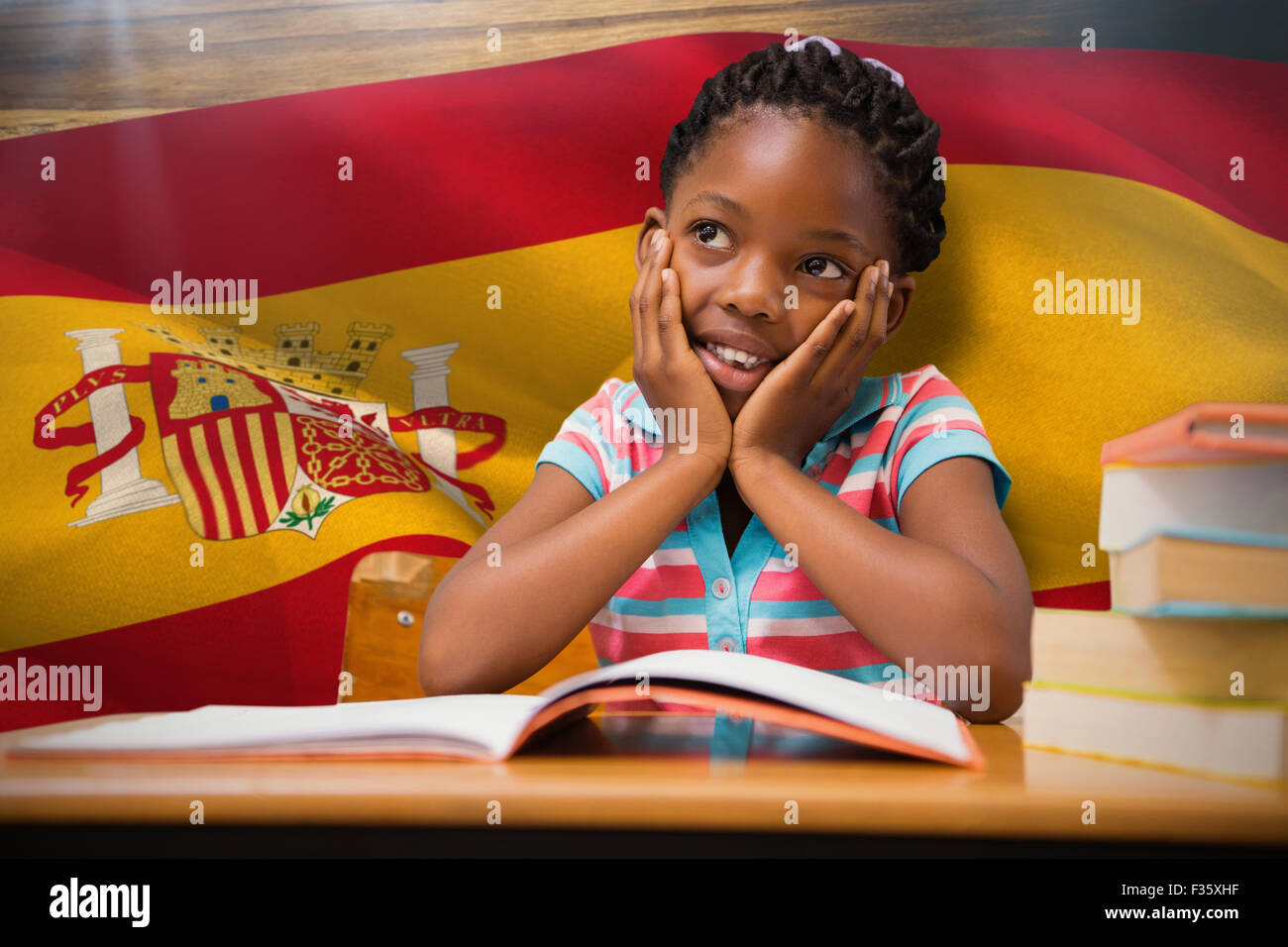 Composite image of pupil sitting at her desk Stock Photo - Alamy