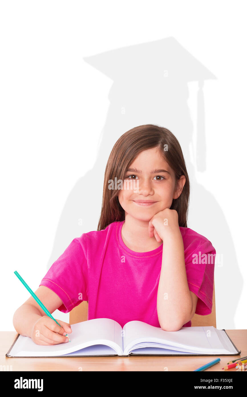Composite image of cute pupil working at her desk Stock Photo - Alamy