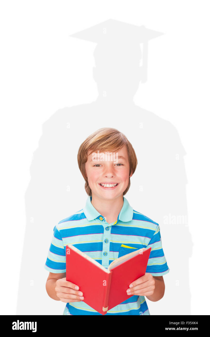 Composite image of cute pupil smiling at camera in library Stock Photo ...