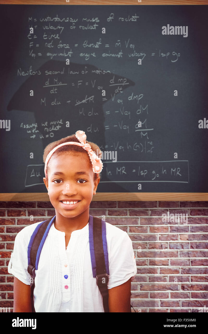 Composite image of little girl smiling in school corridor Stock Photo ...