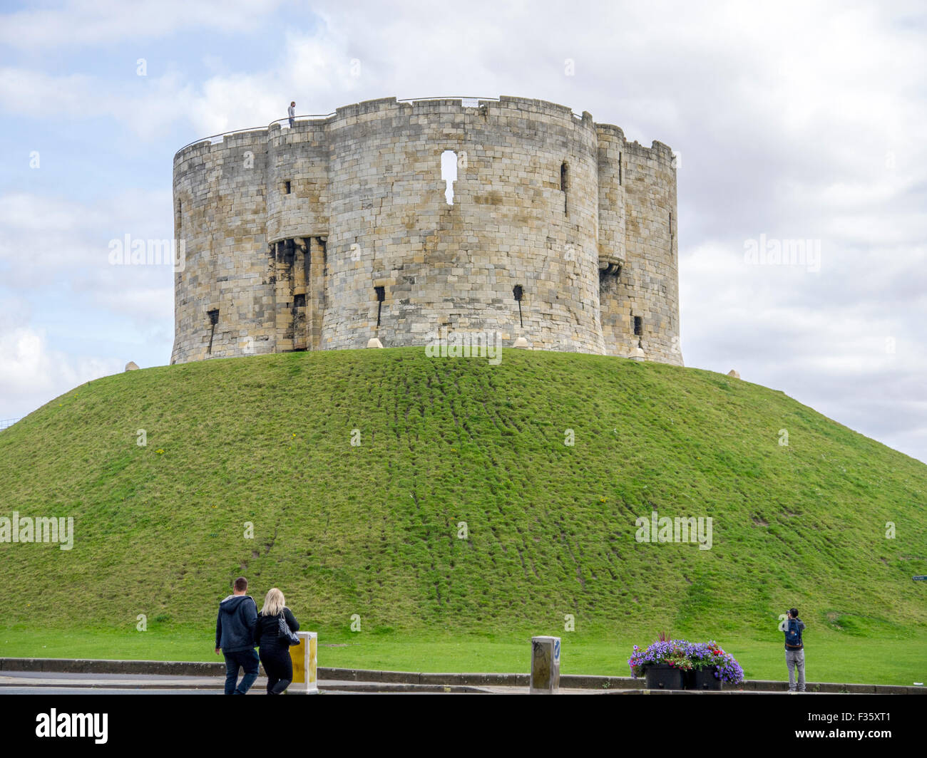 People viewing Cliffords Tower in York Stock Photo