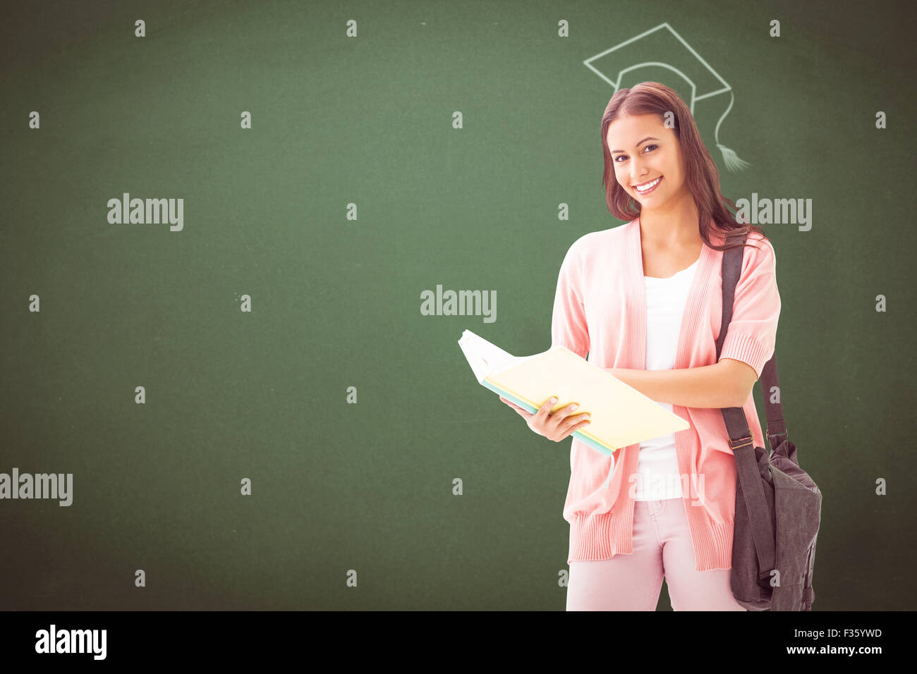 Composite image of pretty student smiling at camera Stock Photo - Alamy