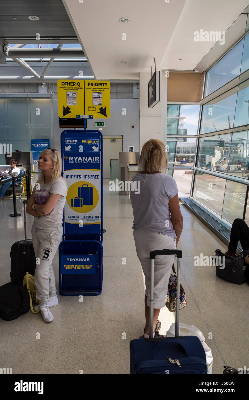 Waiting at the departure gate to board a ryanair flight at Dublin airport, Ireland. Stock Photo