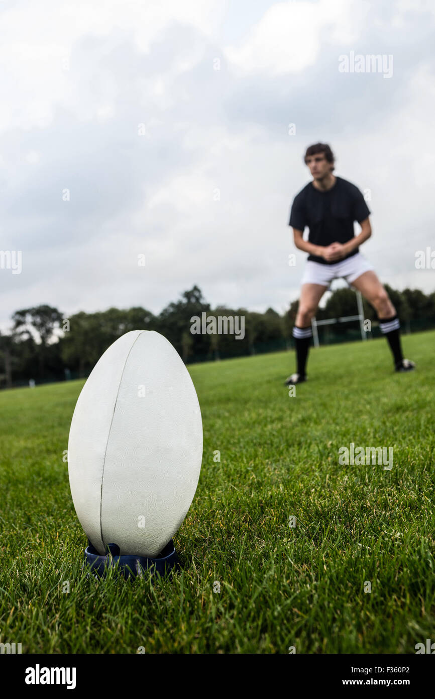 Rugby player about to kick ball Stock Photo Alamy