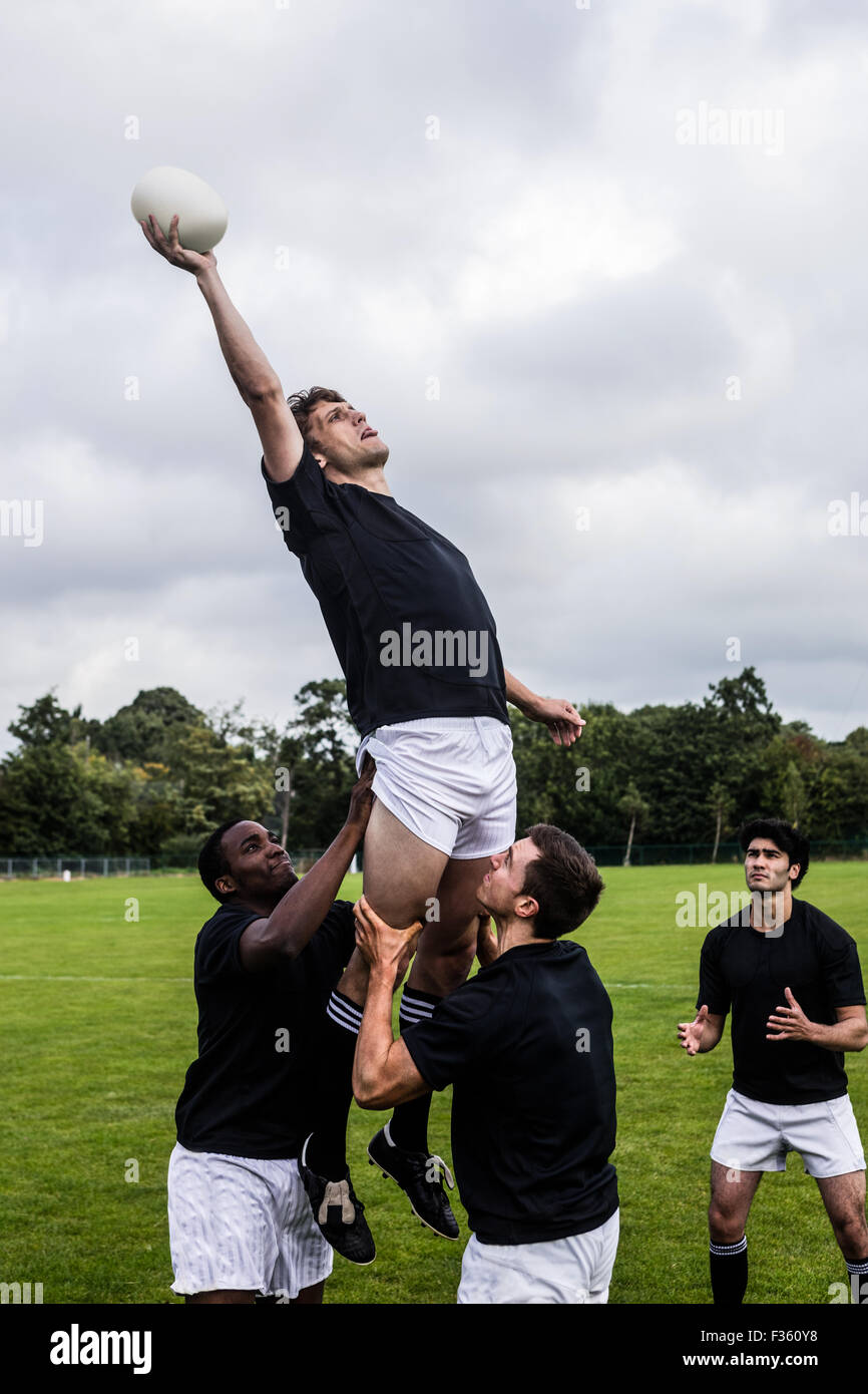 Rugby players jumping for line out Stock Photo Alamy