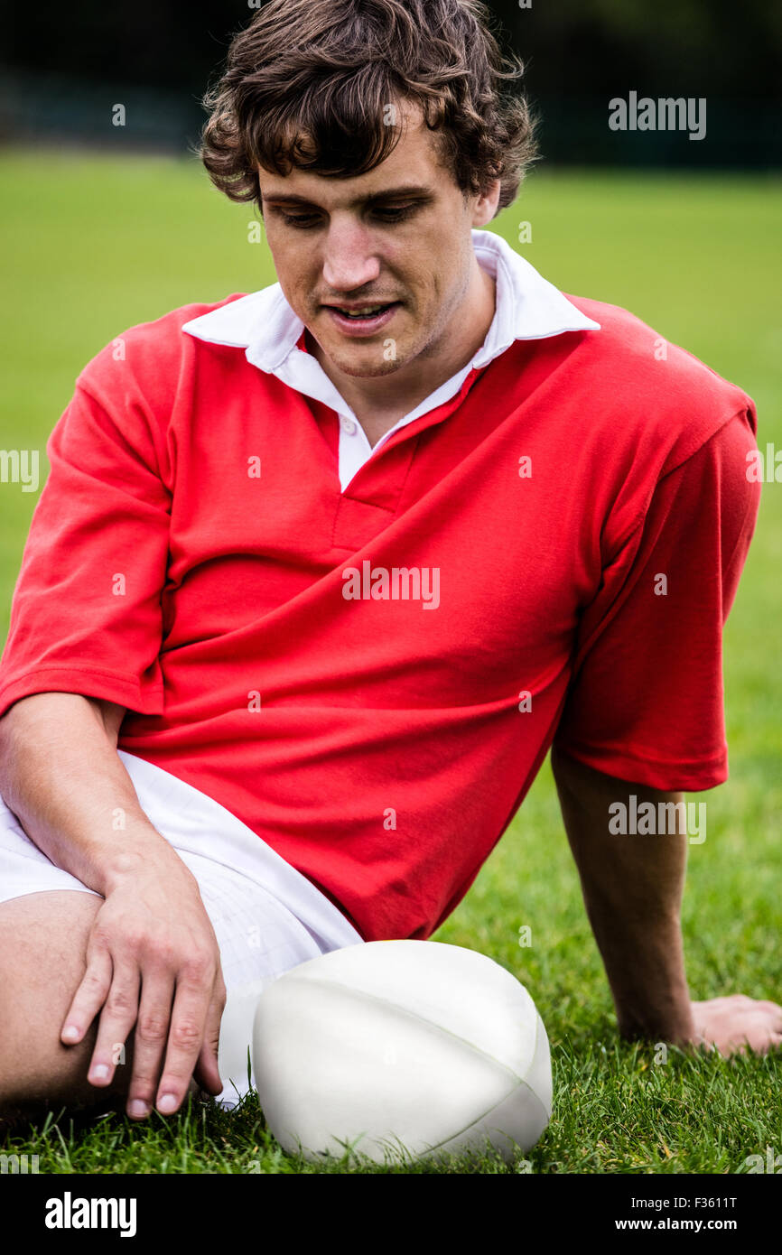 Rugby player sitting on grass before match Stock Photo - Alamy