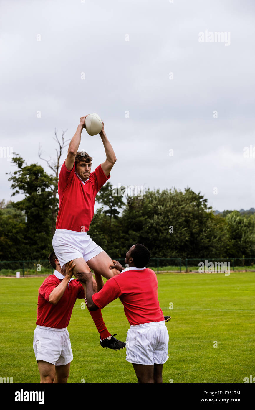 Rugby players jumping for line out Stock Photo