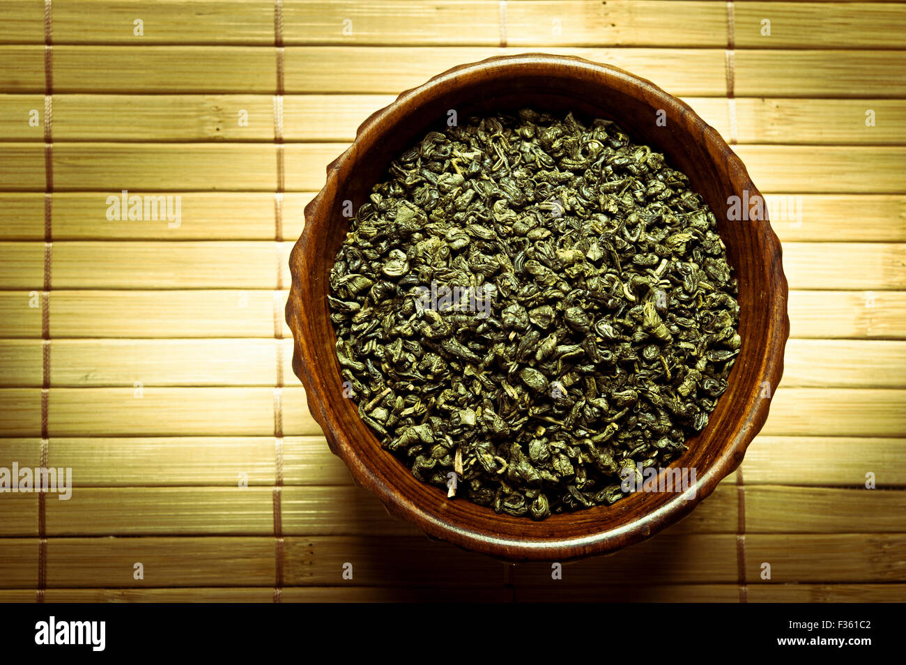 green tea leaves in a bowl Stock Photo Alamy