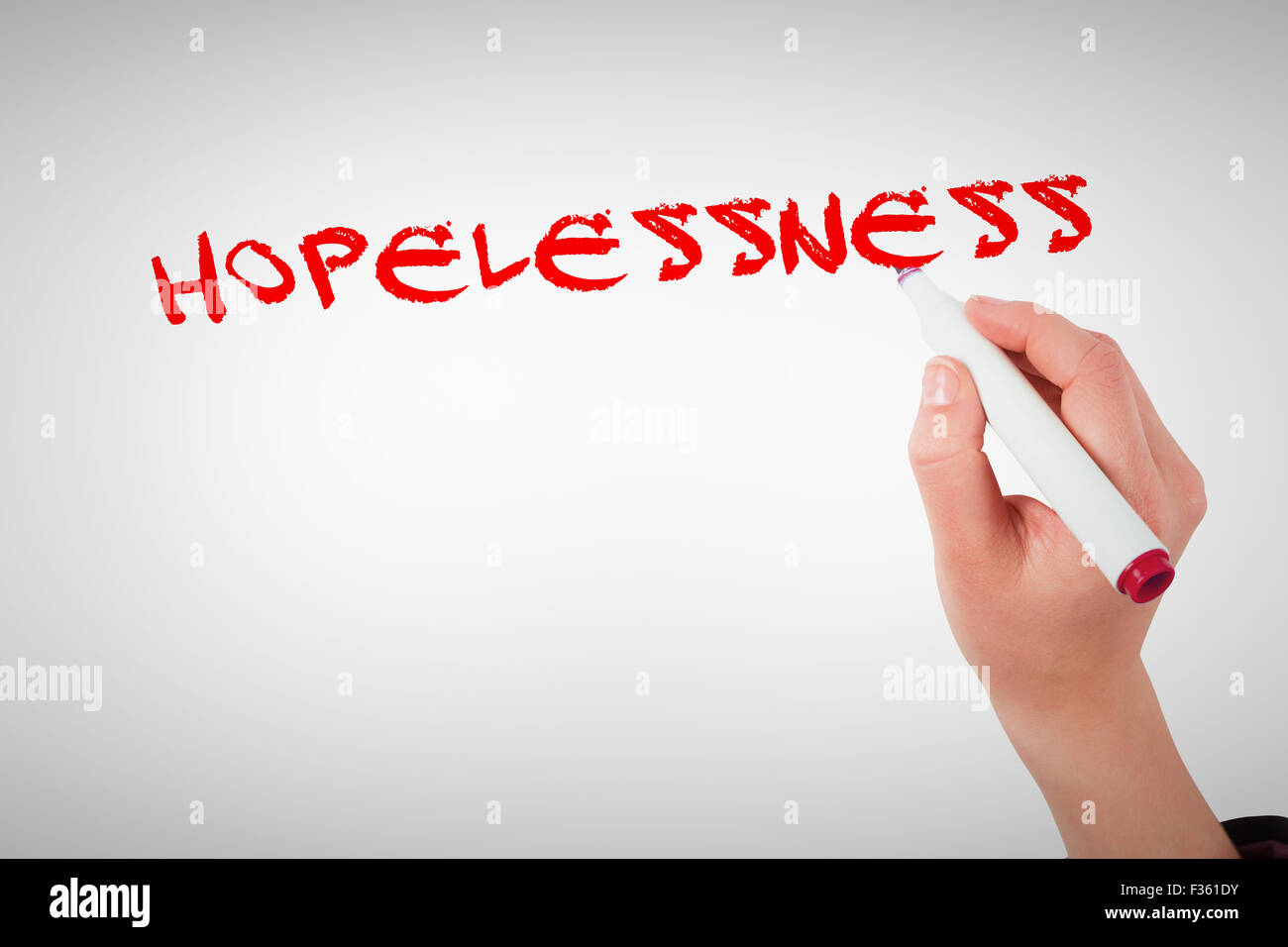 Hopelessness against businesswomans hand writing with marker Stock Photo