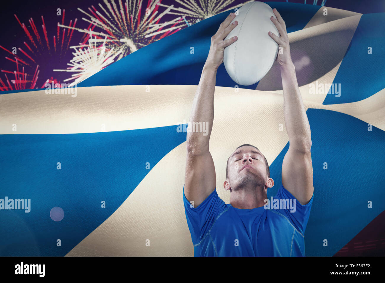 Composite image of rugby player holding ball with eyes closed Stock Photo Alamy