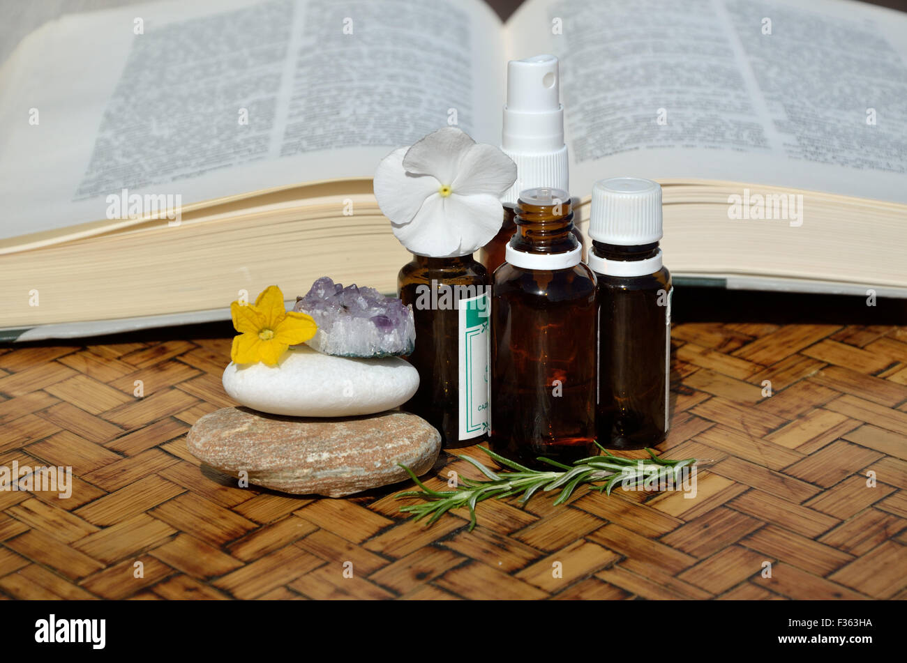 Bottles of homeopathic remedies with a remedy guide book Stock Photo Alamy