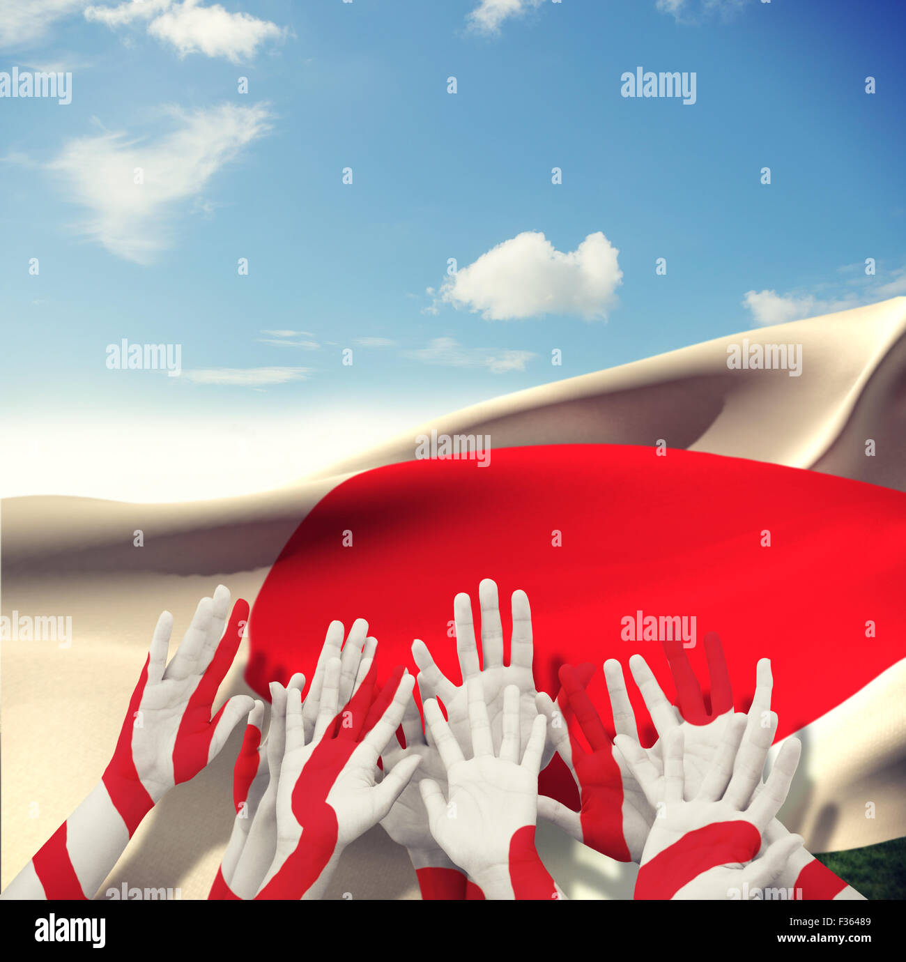 Composite image of people raising hands in the air Stock Photo - Alamy
