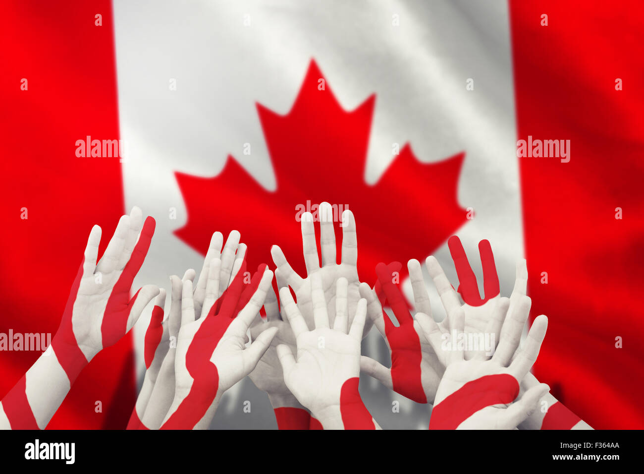 Composite image of people raising hands in the air Stock Photo - Alamy