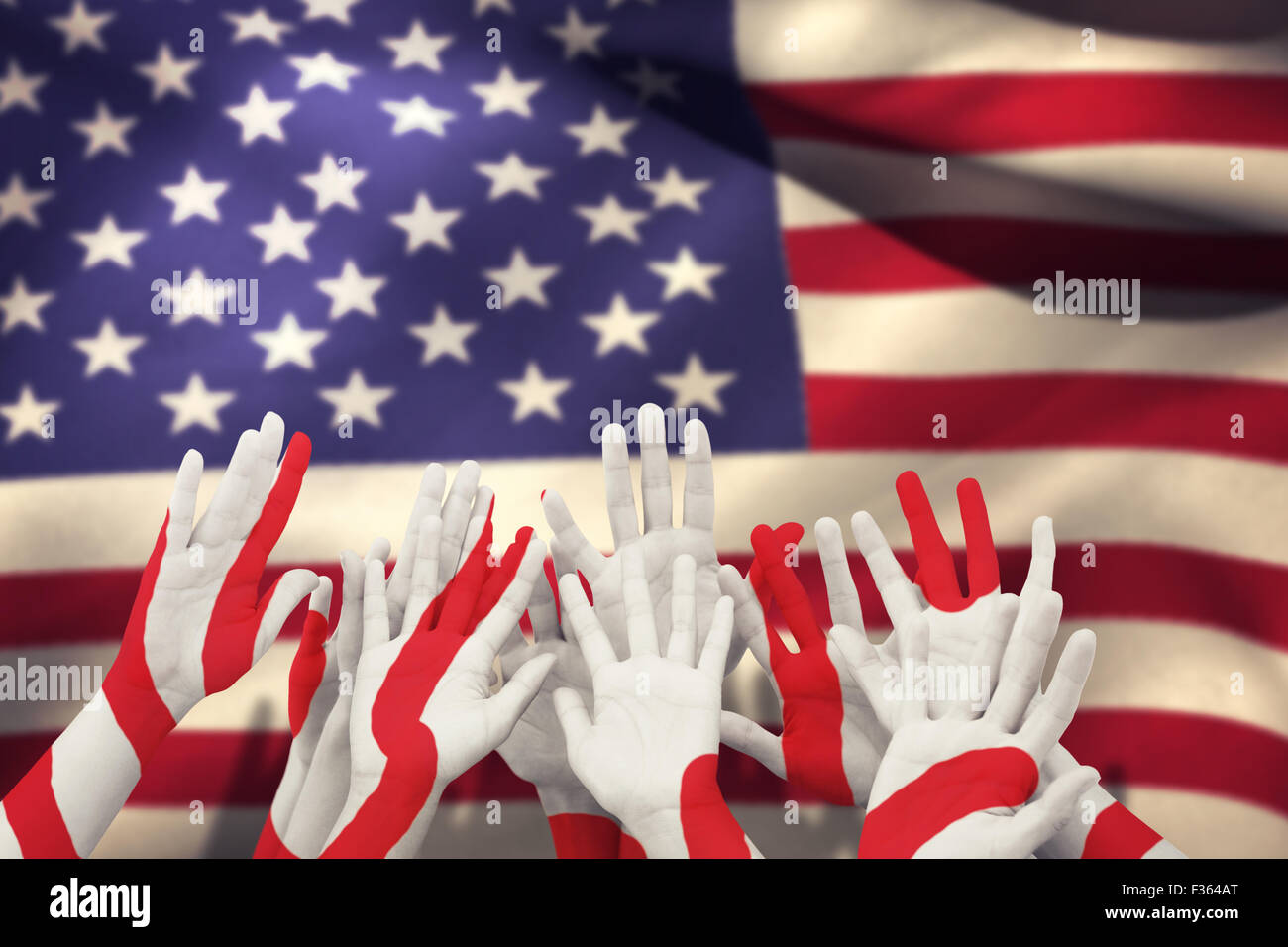 Composite image of people raising hands in the air Stock Photo - Alamy