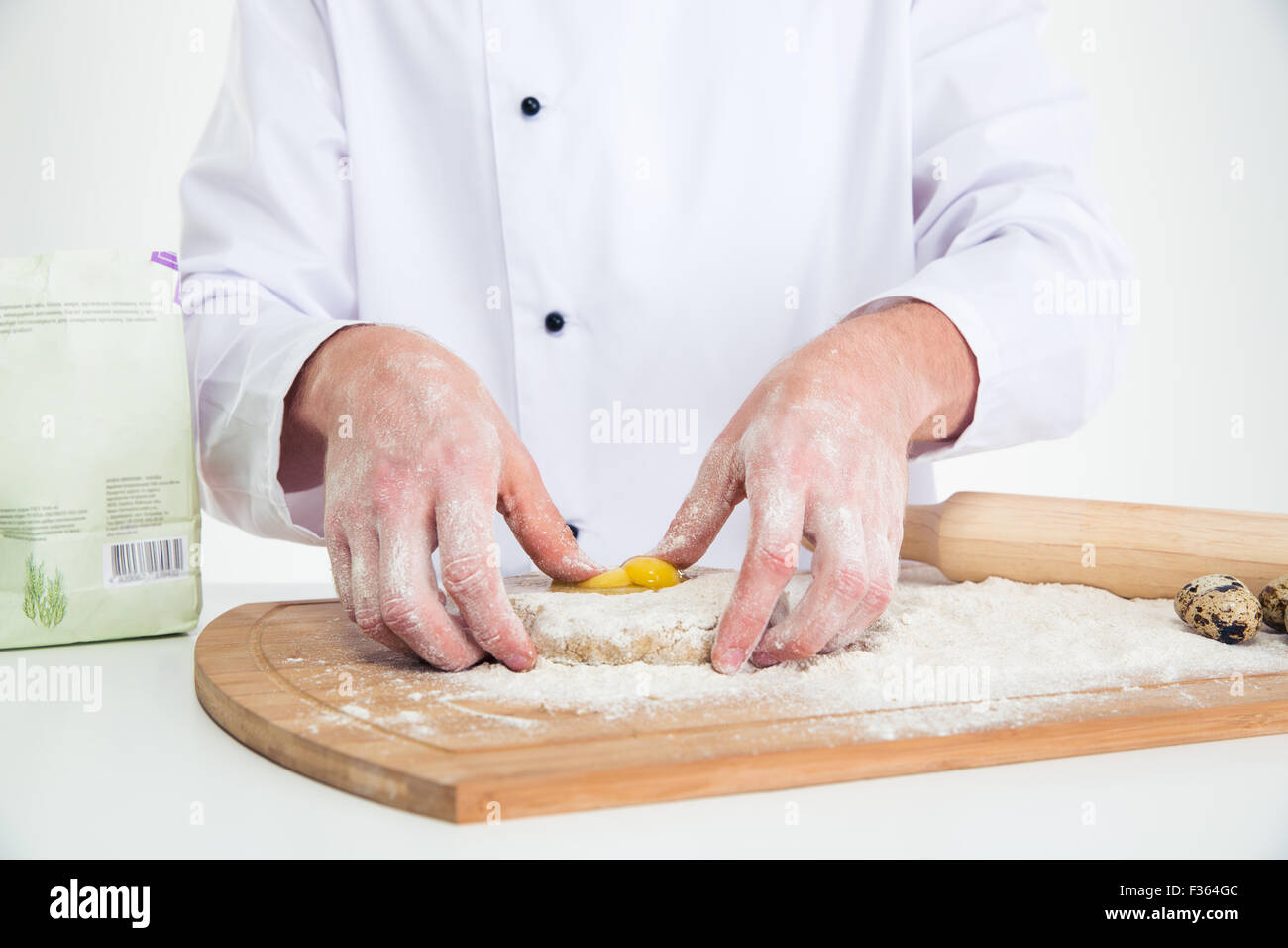 Closeup portrait of a male hands preparing dough for pastry Stock Photo