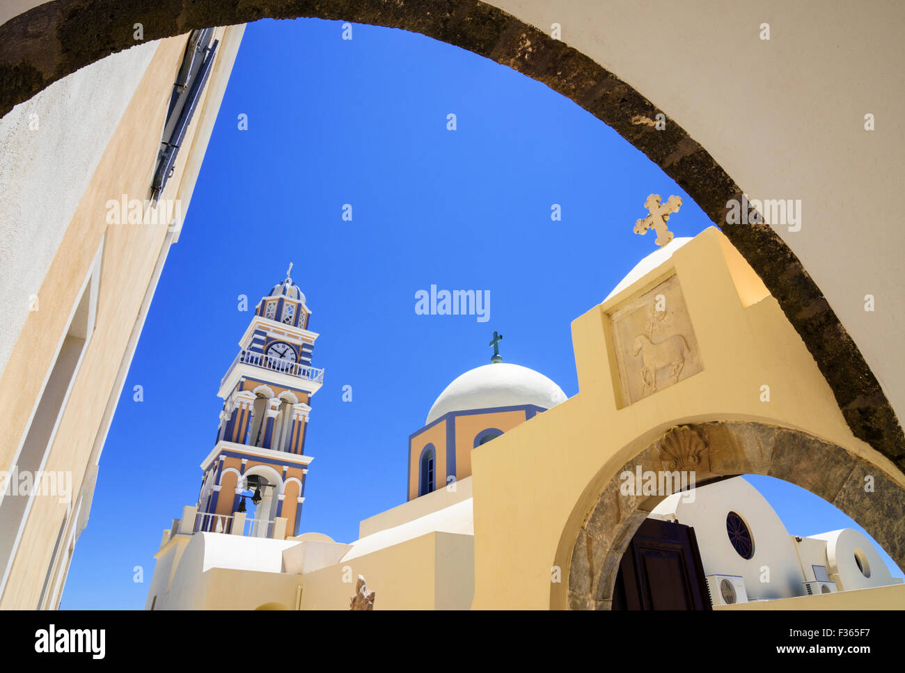 Framed arch views of St. John the Baptist Cathedral in Fira, Santorini ...