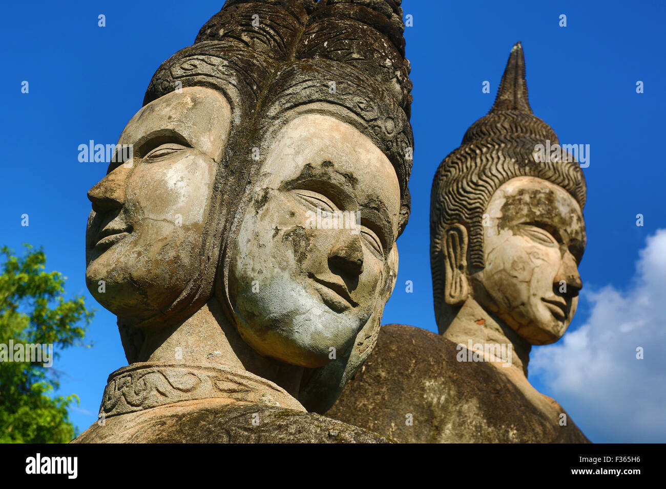 Statues of Buddha heads and faces at the Buddha Park, Vientiane, Laos Stock Photo