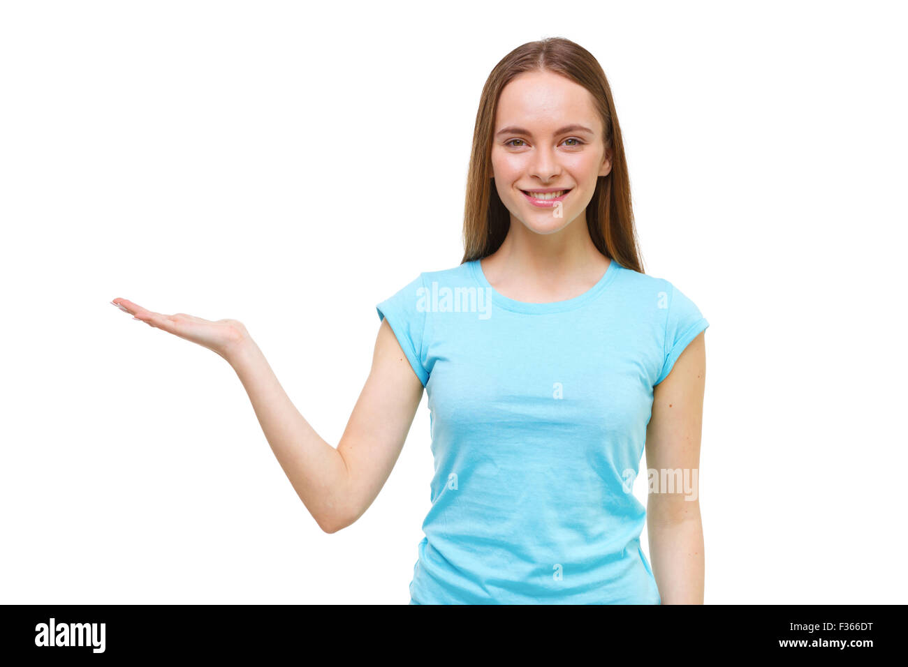 Young woman presenting something with open hand isolated on white background. Stock Photo