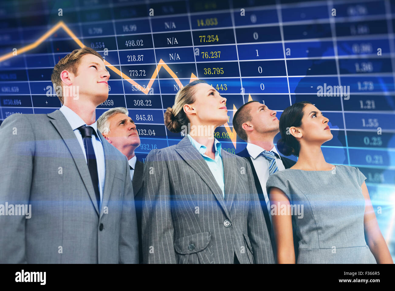 Composite image of business team looking up Stock Photo - Alamy
