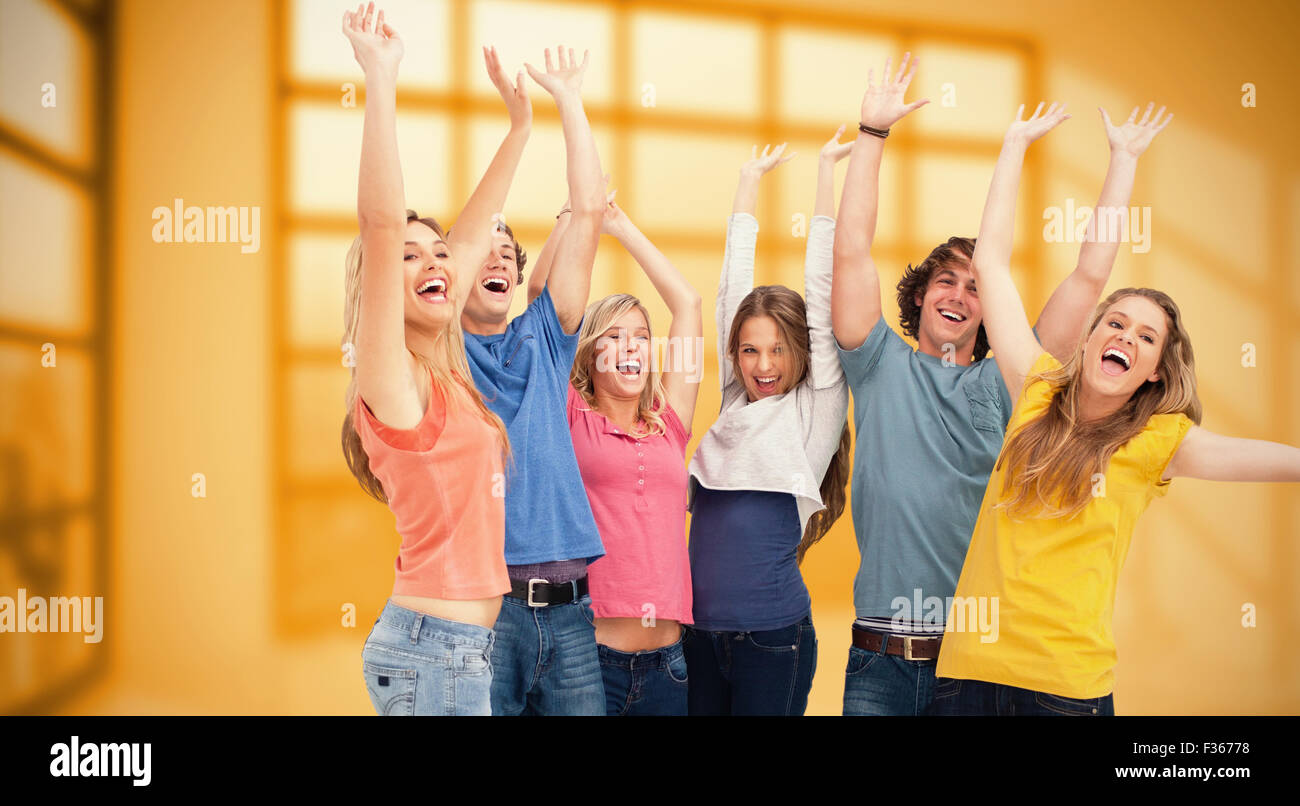 Composite Image Of A Jumping Happy Group Cheering Stock Photo Alamy