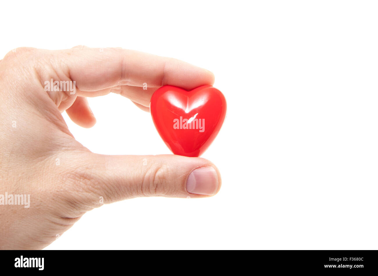 Hand holding red heart. All on white background Stock Photo