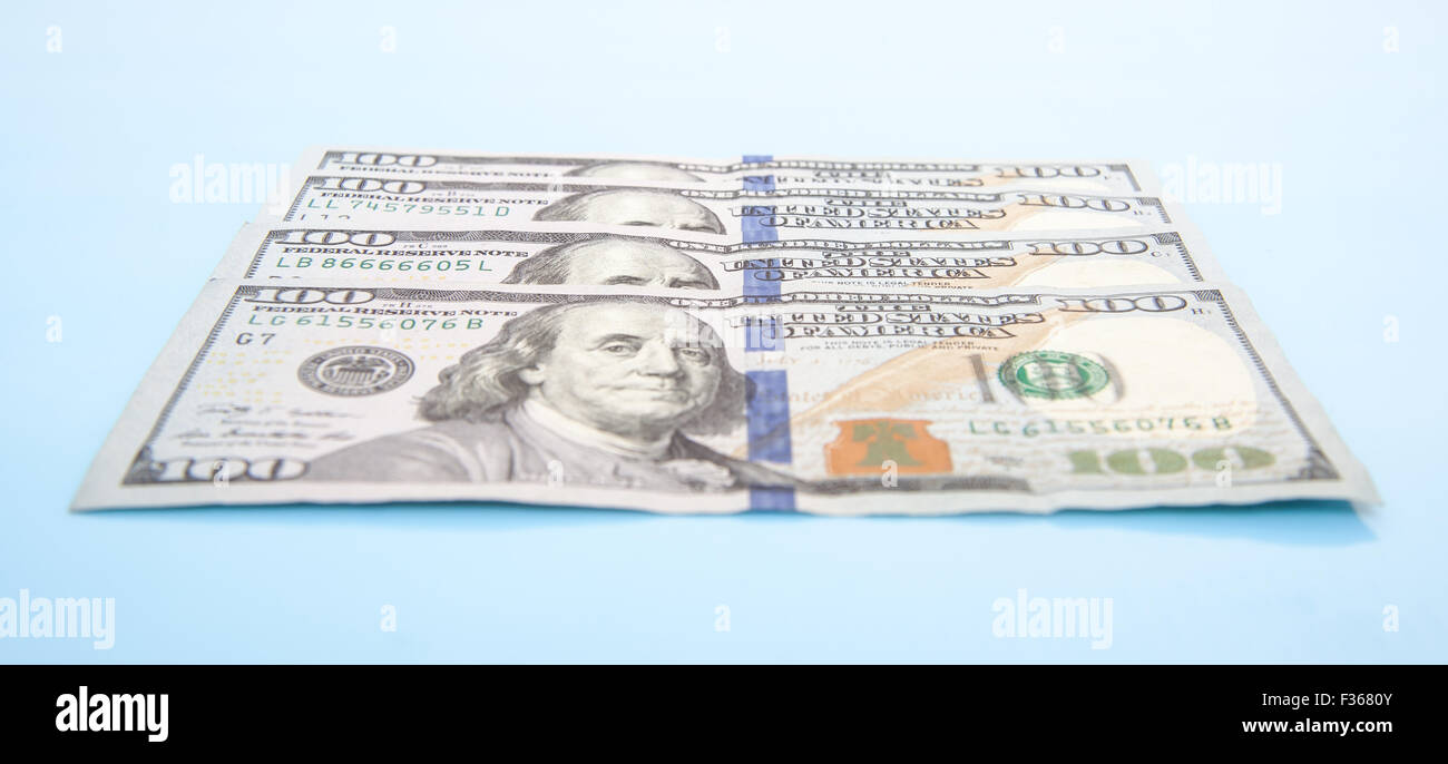 Four hundred dollar notes. All on blue background Stock Photo